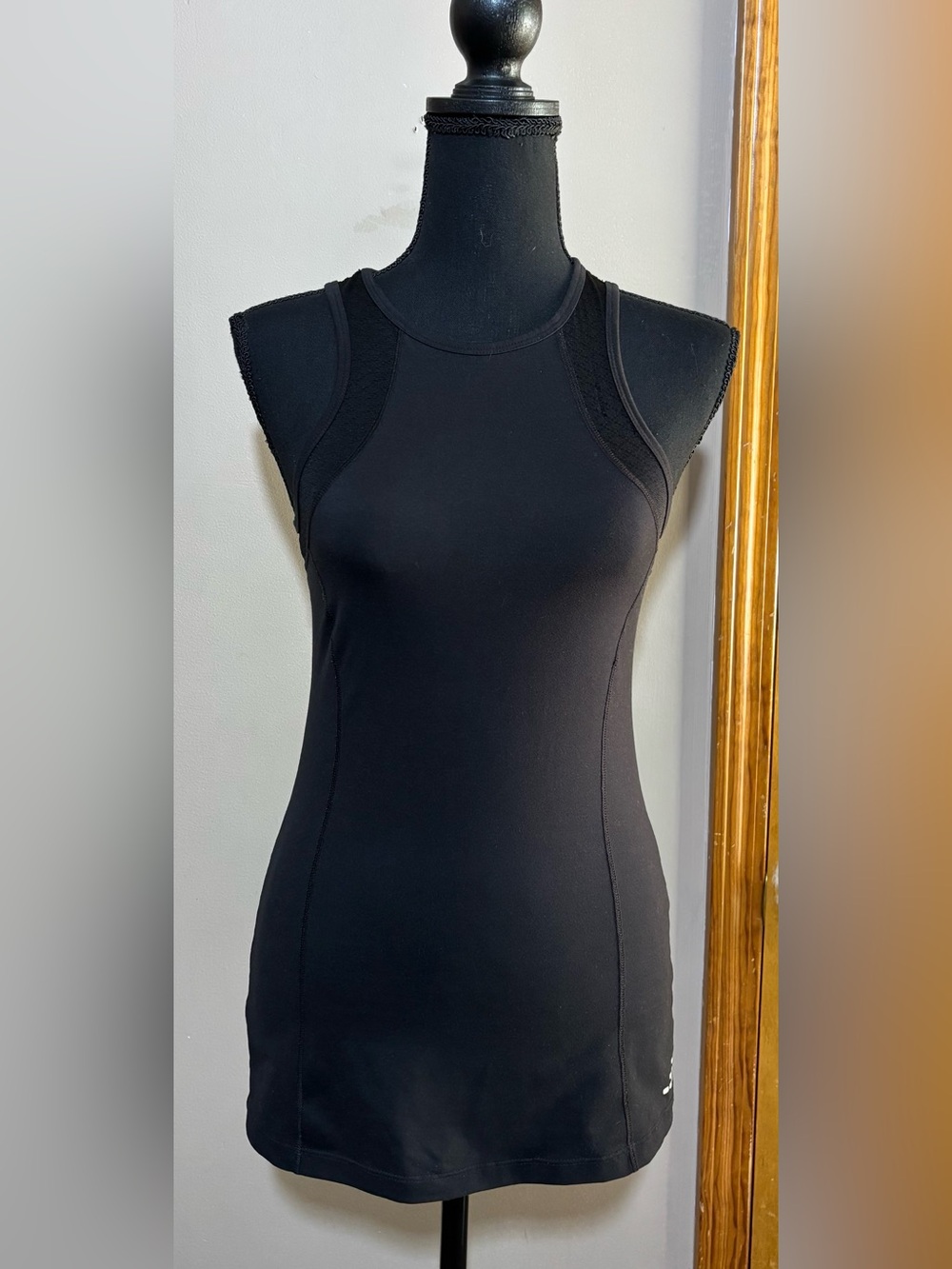 BCG Black tank top with cutout back and mesh accents. S. Slight pull in mesh.